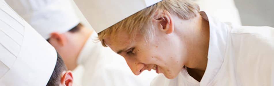 student in chef hat